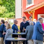 People at a social gathering outdoors.