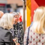 People in conversation at an event