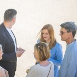 People in conversation outdoors