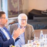 Men at the table during a meeting
