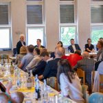 People at a meeting in a hall